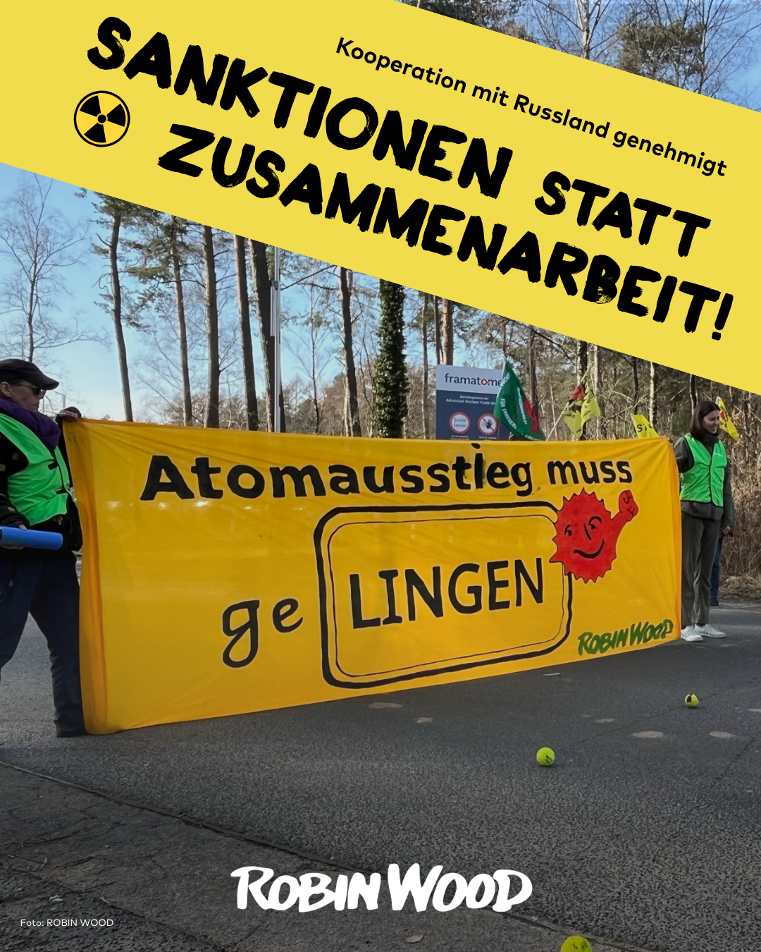 Aktionsfoto vor der Brennelementefabrik Lingen mit Transpi: Atomausstieg muss geLINGEN und Anti-Atom-Sonne, + text: Kooperation mit Russland genehmigt: Sanktionen statt Zusammenarbeit!